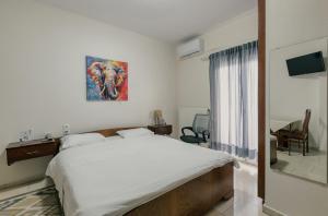 Postel nebo postele na pokoji v ubytování O Fotis Studios & Apartments + 37 fotografií