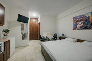 Postel nebo postele na pokoji v ubytování O Fotis Studios & Apartments
