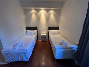 Postel nebo postele na pokoji v ubytování Vattengrändens Vandrarhem & Hotel