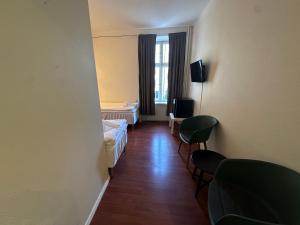 TV a/nebo společenská místnost v ubytování Vattengrändens Vandrarhem & Hotel