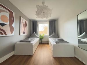 Postel nebo postele na pokoji v ubytování 3 Zimmer - city -Parkplatz - MalliBase Apartments