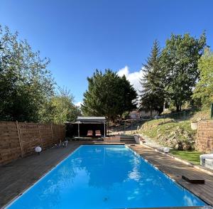 a swimming pool in the backyard of a house at Maison avec piscine in Gaillac