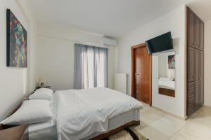 Postel nebo postele na pokoji v ubytování O Fotis Studios & Apartments
