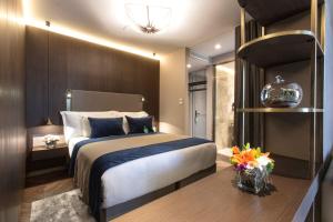 Кровать или кровати в номере Noble22 Suites-Special Category