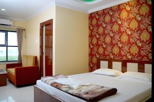 Postel nebo postele na pokoji v ubytování Hotel Royal Sunview