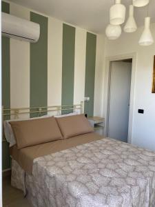 Postel nebo postele na pokoji v ubytování B&B La Milanese