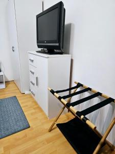 A television and/or entertainment centre at Dani Home Apartman