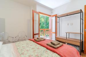 En eller flere senge i et værelse på Lindo Apto no Centro de Santo Antonio do Pinhal/SP + 30 billeder