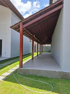 a large pavilion with a hose on the grass at Praia dos Carneiros Condomínio Village in Tamandaré