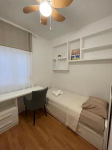 En eller flere senge i et værelse på Valencia Apartamento Sol de Naranja