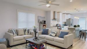 a living room with two couches and a kitchen at My Cozy Beach House Cape May Court House NJ Pool Near Wildwood and Cape May in Whitesboro