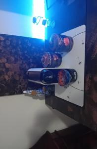 two bottles of wine are on a wall at LaCiliegia monolocale in Bonnanaro