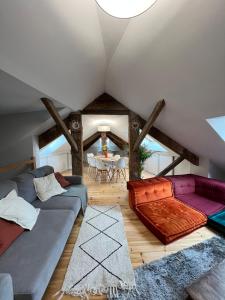 a living room with a couch and a table at Appartement au cœur de Cauterets - vue montagne - Wifi in Cauterets