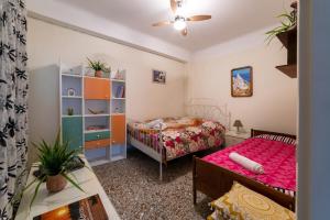 Posteľ alebo postele v izbe v ubytovaní Acropolis Crib Spot