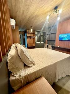 a bedroom with a large bed in a room at Apartamento Beira Mar NEW TIME 1014 in Maceió +35 photos
