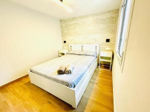 En eller flere senge i et værelse på Casita Pescadores