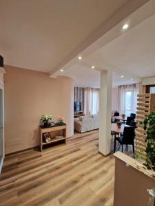 a living room with a table and a dining room at Bed & Breakfast L'Incanto Intero Appartamento in Pisa