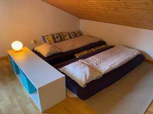 En eller flere senge i et værelse på Apt Sakura - Le Grand Tetras + 25 billeder