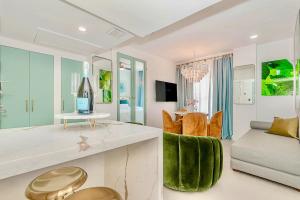 a living room with a couch and a table at 2-Min to Beach, Upscale Enclave in Miami Beach