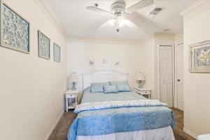 a bedroom with a bed and a ceiling fan at Two Bedroom St Augustine Retreat in Saint Augustine