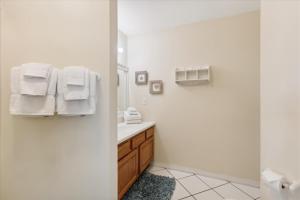 a white bathroom with a sink and a mirror at Two Bedroom St Augustine Retreat in Saint Augustine +18 photos