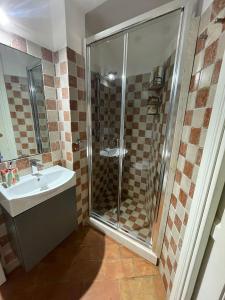 a bathroom with a shower and a sink at Suite "La Finestra su Alghero" in Alghero +31 photos