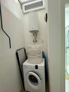 a washing machine with a light on top of it at Vistabella - Las Vistas Beach, Los Cristianos in Arona +5 photos