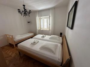 Postel nebo postele na pokoji v ubytování Apartment Abba
