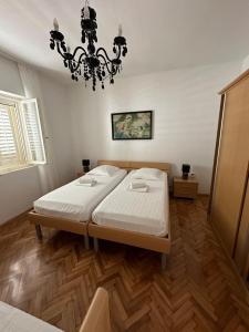 Postel nebo postele na pokoji v ubytování Apartment Abba