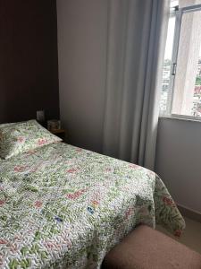 Ένα ή περισσότερα κρεβάτια σε δωμάτιο στο Apartamento Confortável para até 5 pessoas