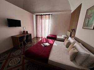 TV a/nebo společenská místnost v ubytování Terra d'amuri Rooms
