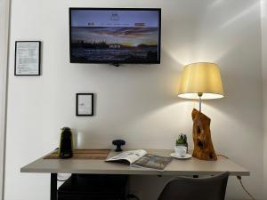 TV a/nebo společenská místnost v ubytování Terra d'amuri Rooms