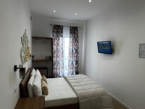 Postel nebo postele na pokoji v ubytování Terra d'amuri Rooms