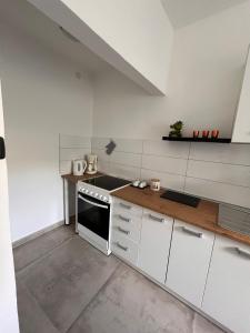 Kuchyňa alebo kuchynka v ubytovaní Apartments Mirijana