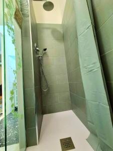 a shower with a glass door in a bathroom at casa giustina in Ventimiglia