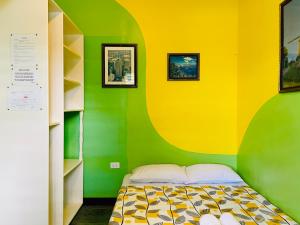 Postel nebo postele na pokoji v ubytování Citadel Alona Inn