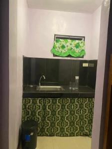 TV a/nebo společenská místnost v ubytování Mariah Guest House