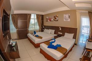 Letto o letti in una camera di Wave View Hotel
