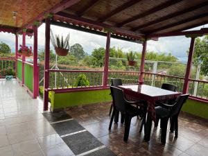 a porch with a table and chairs on a balcony at La victoria in Marsella