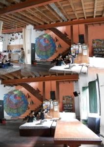 a room with beds and people sitting on them at centro cultural da flor in Salvador