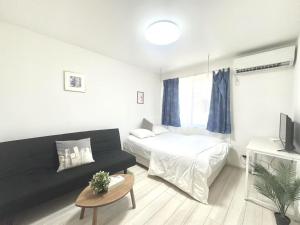 Postel nebo postele na pokoji v ubytování ティエラ北池袋