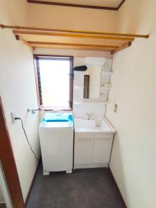 Kuchyň nebo kuchyňský kout v ubytování ビーチまで徒歩5分 BBQ無料 7名迄OK 戸建て貸切宿 Bignet villa + 37 fotografií