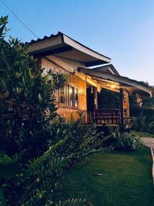 a house with a porch with lights on it at Rakkhao Inthanon sunset view in Ban Yang Di Pha Mop