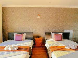 Postel nebo postele na pokoji v ubytování Leng Sengna Hotel