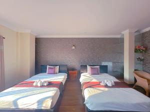 Postel nebo postele na pokoji v ubytování Leng Sengna Hotel
