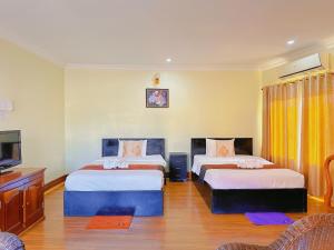 Postel nebo postele na pokoji v ubytování Leng Sengna Hotel