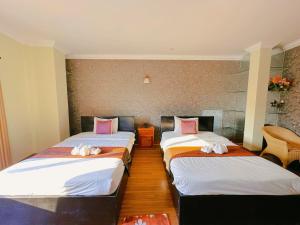 Postel nebo postele na pokoji v ubytování Leng Sengna Hotel