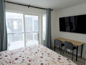 a bedroom with a bed and a table and a window at King Bed TV Private Ensuite Retreat Bathroom or Economical Double Bed Room in Toronto +19 photos