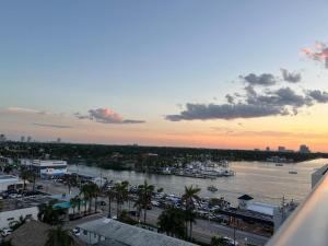 a view of a harbor with a marina at sunset at AMIRI Hollywood 5 mins from Hard Rock Stadium & The Guitar in Hollywood