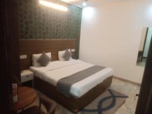 Postel nebo postele na pokoji v ubytování HOTEL S R PLAZAa